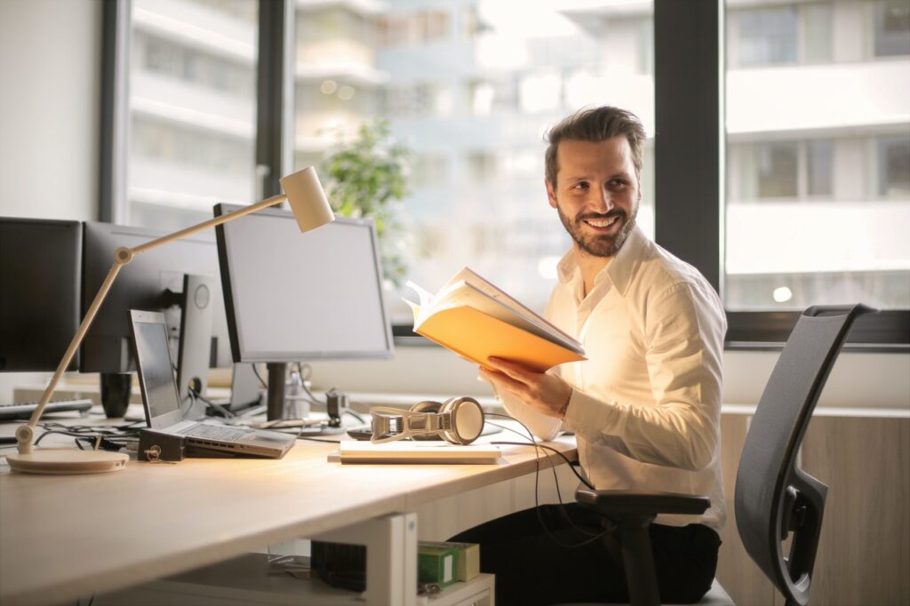man-on-table-white-shirt